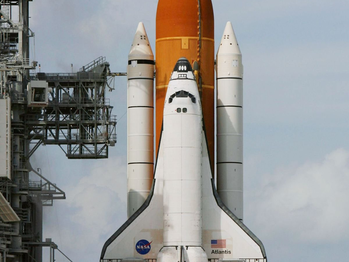 A space shuttle ready on the pad, symbolising the exploratory mission guarded by the community